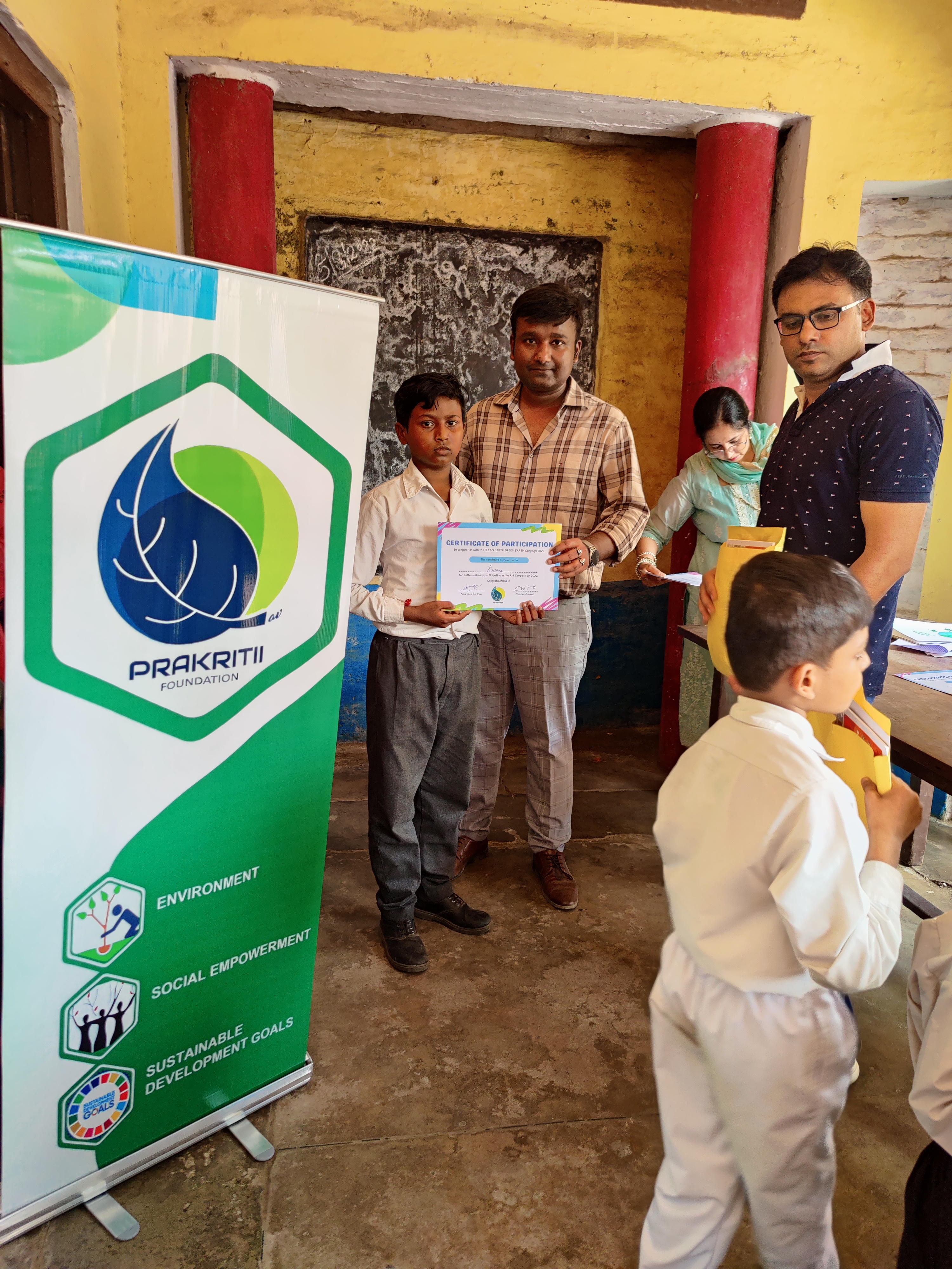 Prakritii Foundation volunteers with school children